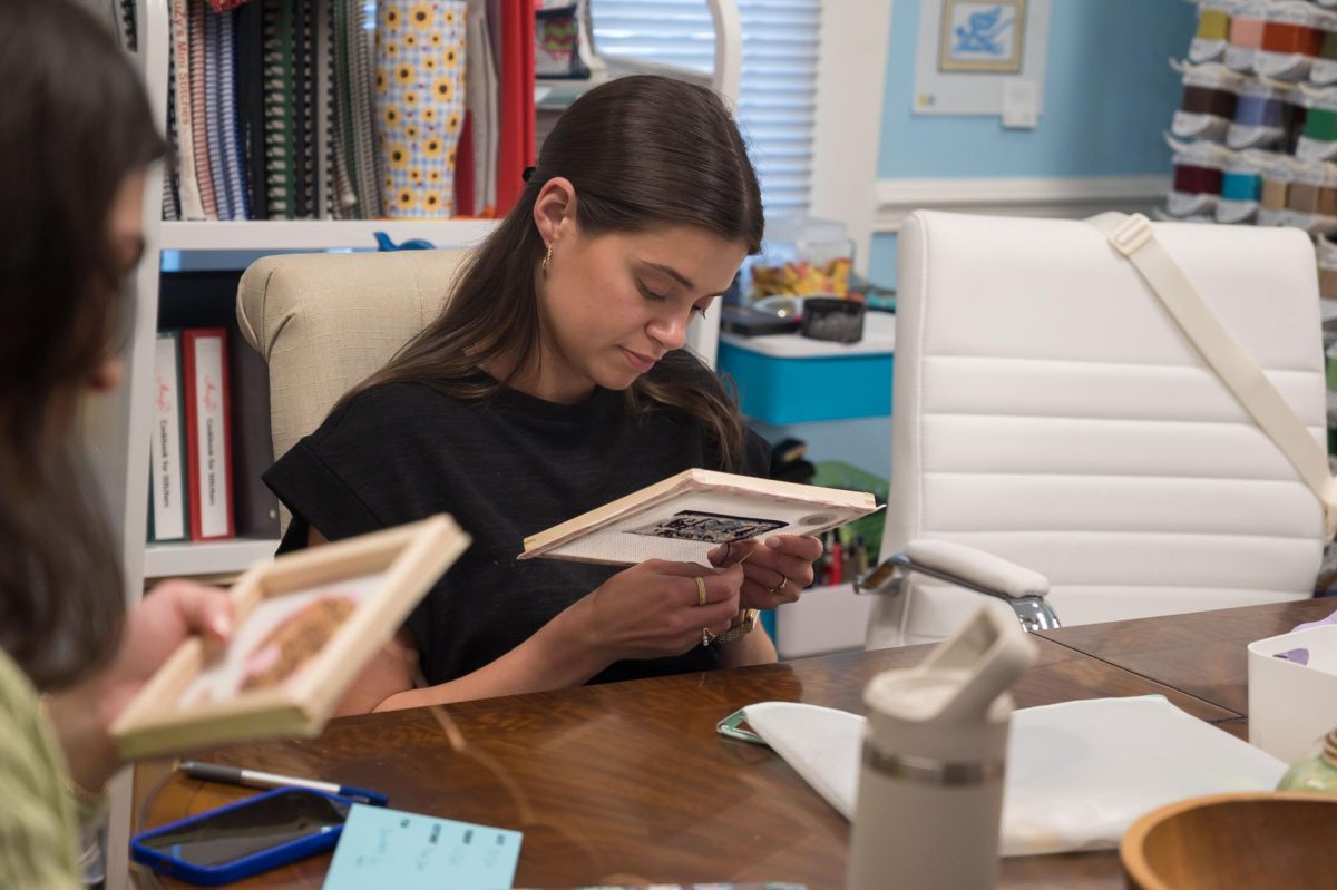 Sitch Social BR member Kaitlyn Braud works on her latest project, Monday, March 17, at the Elegant Needle.