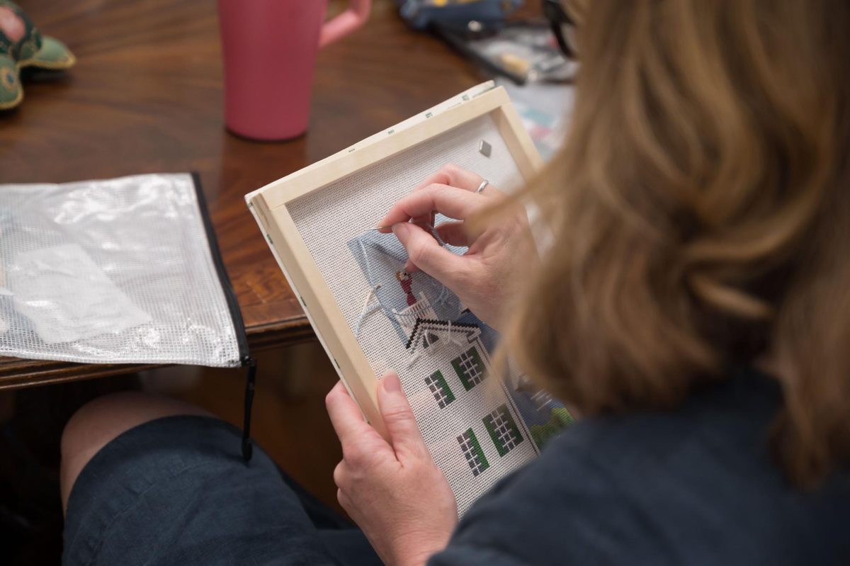 Sitch Social BR member Mary Bean works on her latest project, Monday, March 17, at the Elegant Needle.