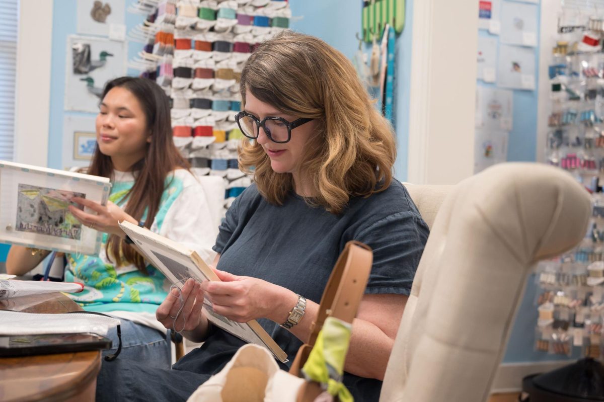 Stitch Social BR member Mary Bean works on her latest project, Monday, March 17, at the Elegant Needle.